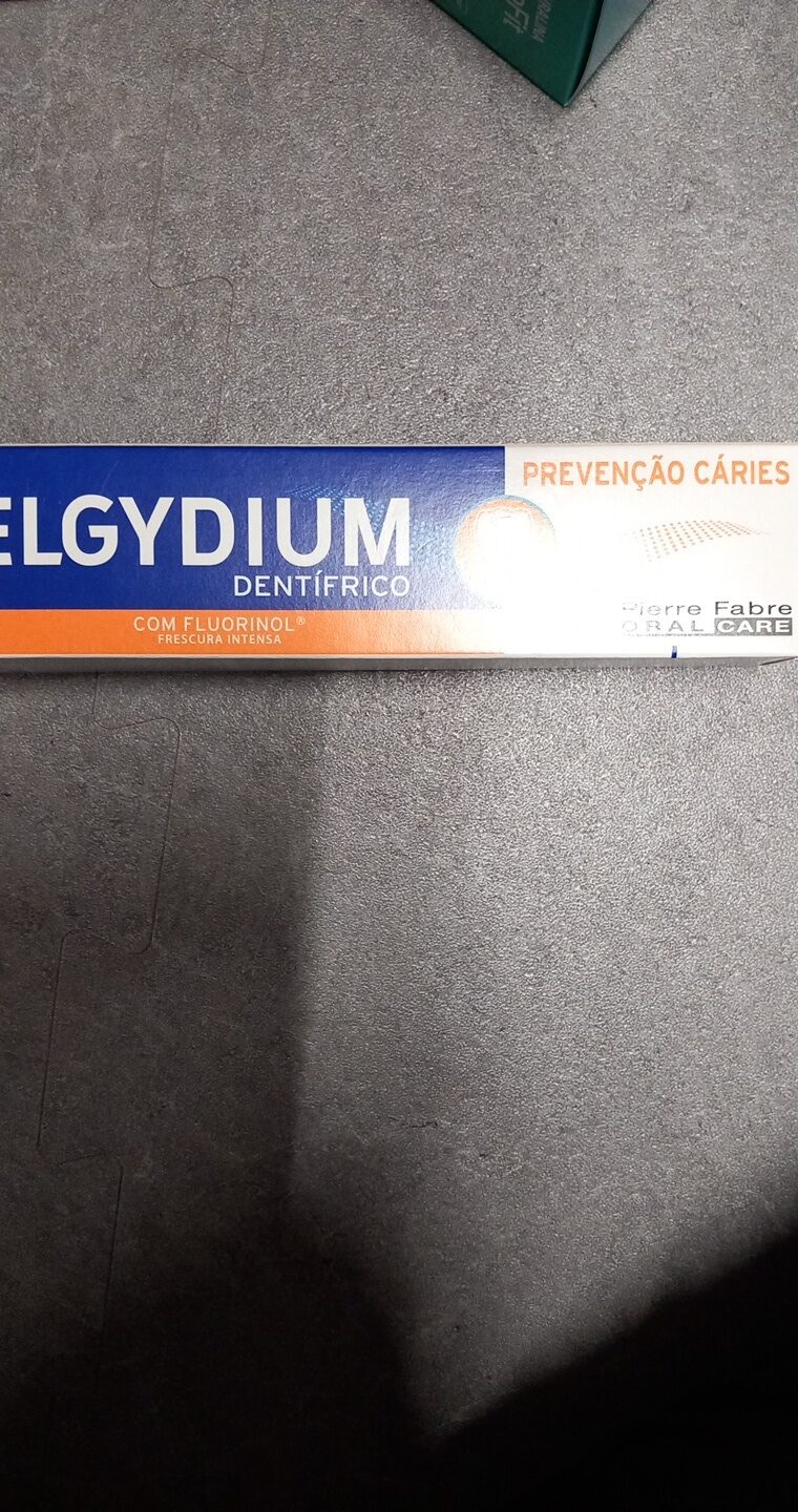 Elgydium dentífrico cáries - نتاج - pt